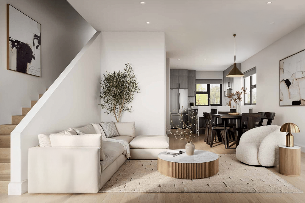 Open-concept living room at Rouge Townhomes with large windows