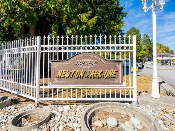 Property sign positioned at 104 13915 72 Avenue in Surrey community.