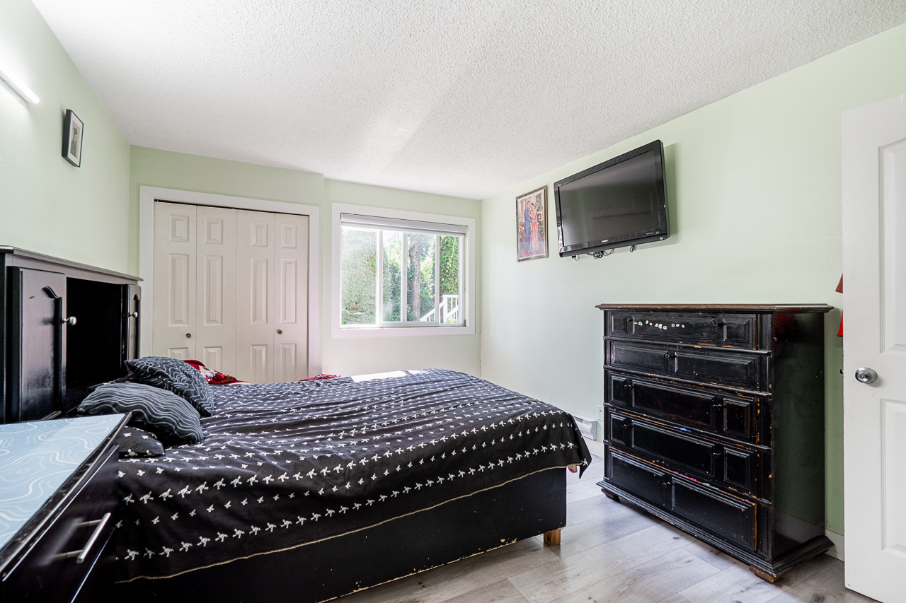 Unit 104 13915 72 Avenue Surrey-22 Spacious primary bedroom at 104 13915 72 Avenue featuring natural light and neutral tones.