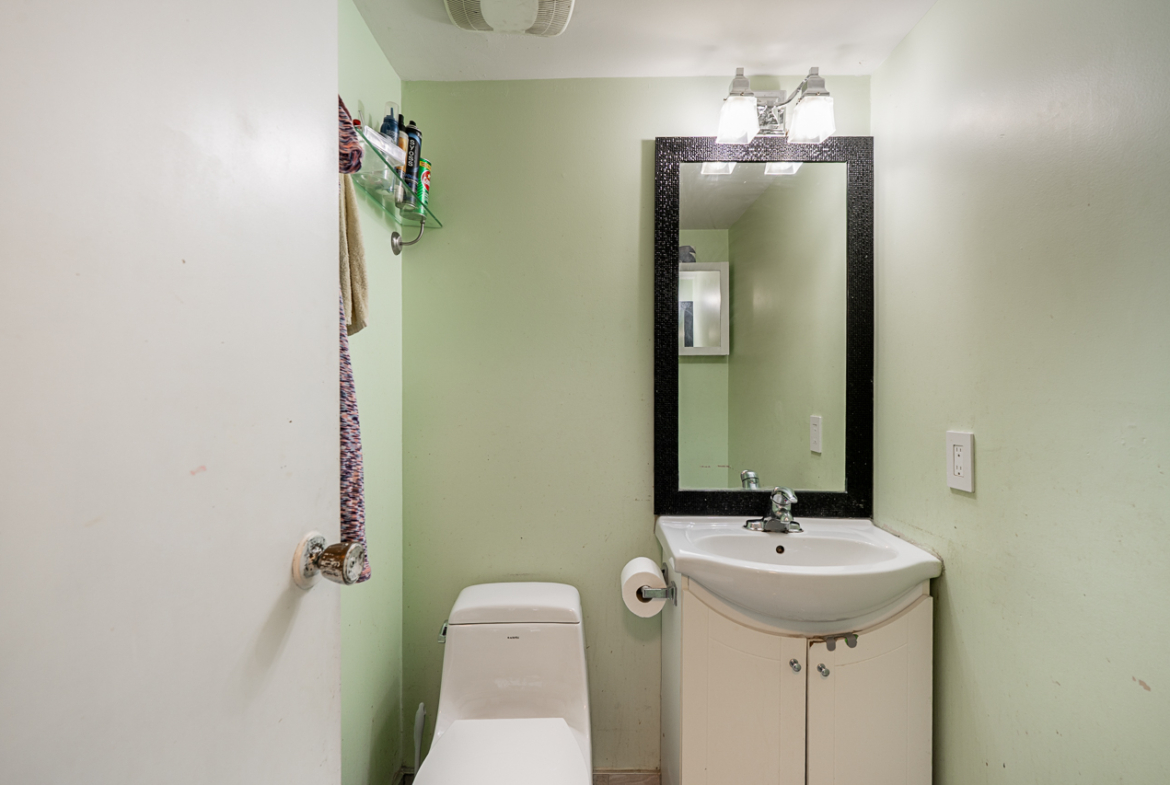 Well-maintained bathroom at 104 13915 72 Avenue featuring bright lighting and tiled flooring.