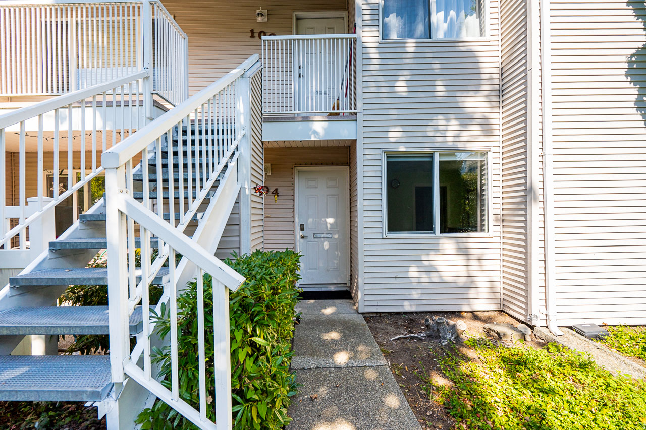 Unit 104 13915 72 Avenue Surrey-7 Well-maintained entrance at 104 13915 72 Avenue with modern door and tidy finish.