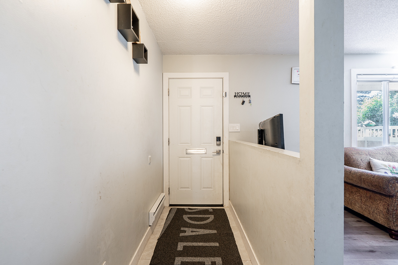 Unit 104 13915 72 Avenue Surrey-8 Bright entryway at 104 13915 72 Avenue featuring functional layout and easy access to main living area.