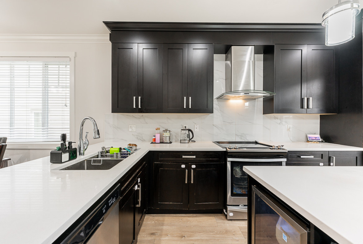 Open kitchen with stainless steel appliances at 170 13898 64 AVENUE