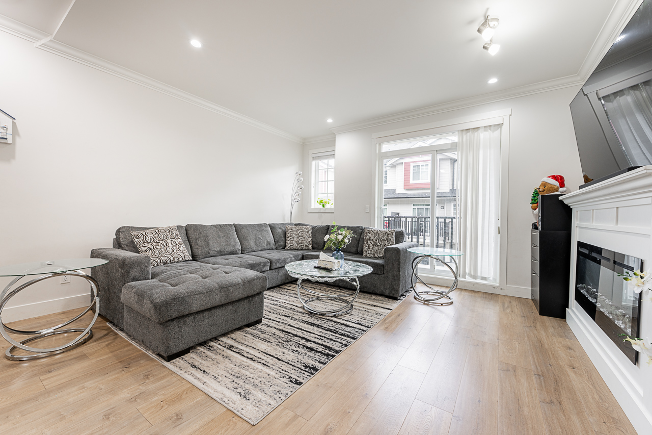 Bright living room at 170 13898 64 AVENUE townhome