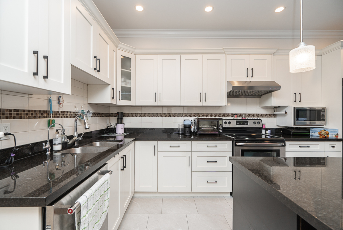 Modern kitchen with granite countertops at 30 6383 140 STREET