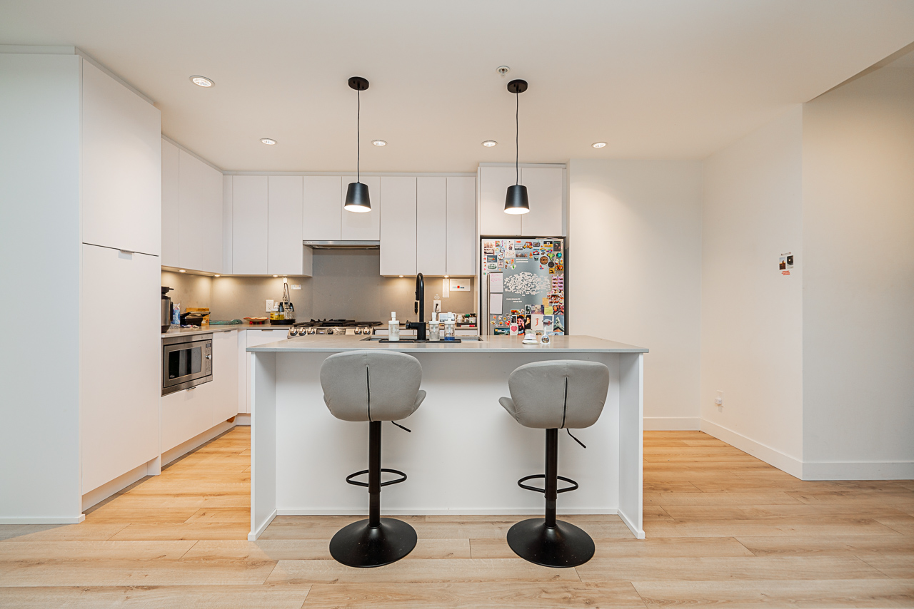 Unit 301 2493 Montrose Avenue Abbotsford-10 – Copy Dining space with natural light and modern lighting fixture