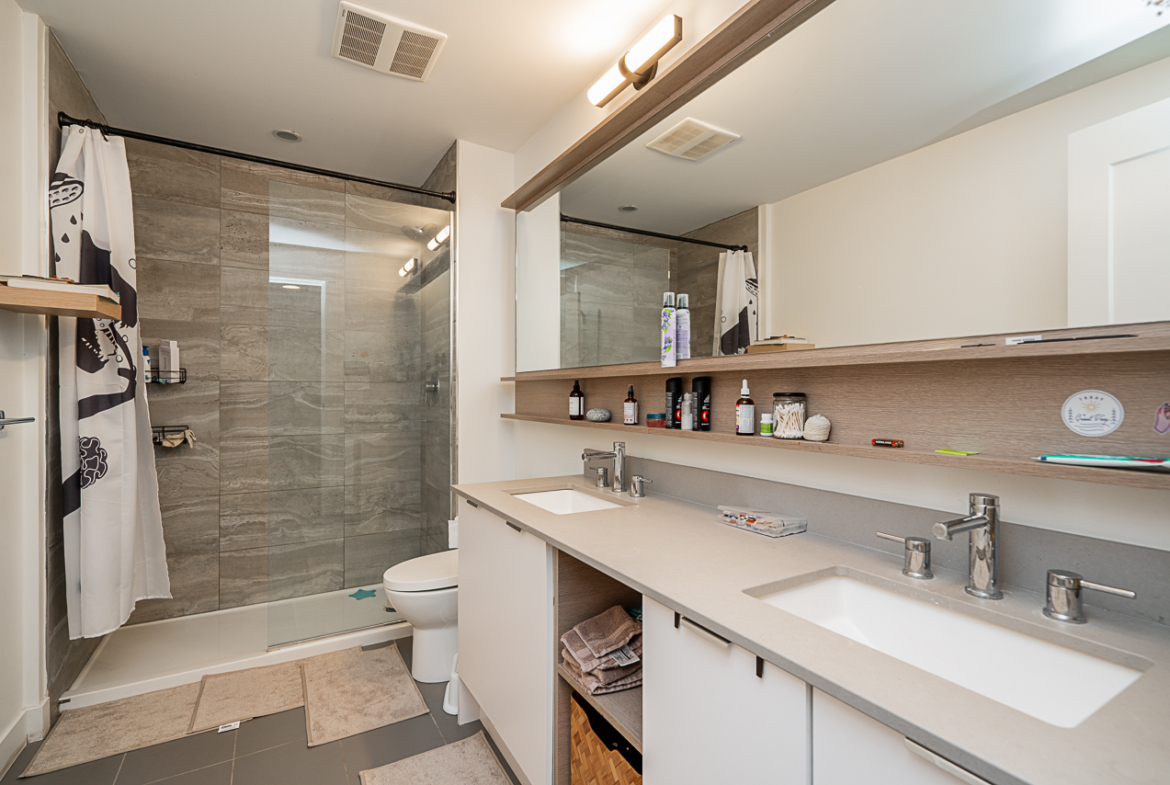 Spa-inspired ensuite bathroom with modern vanity and shower