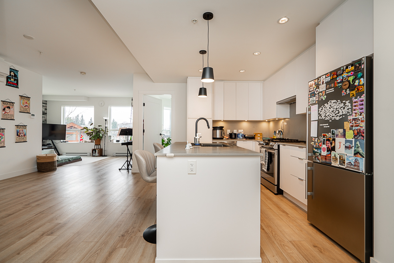 Unit 301 2493 Montrose Avenue Abbotsford-6 – Copy Open dining area beside kitchen in modern condo layout
