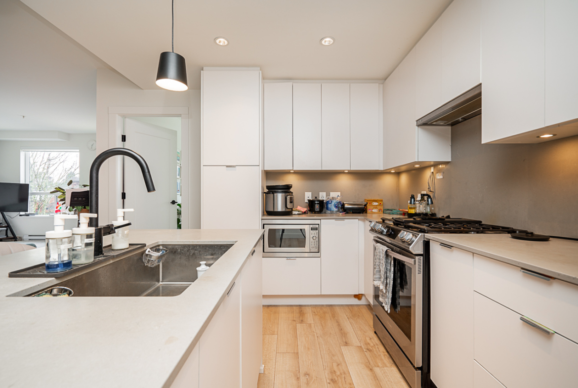 Modern condo kitchen with sleek cabinetry and open layout