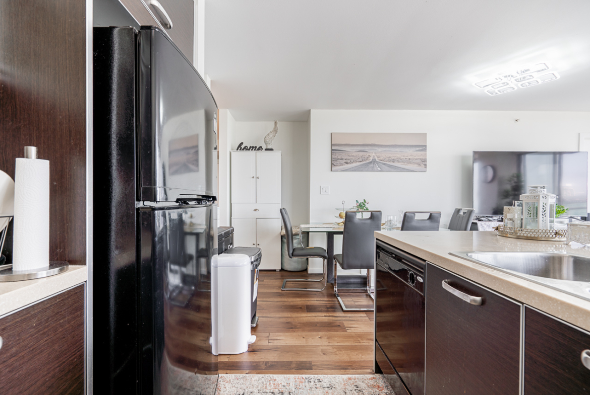 Open kitchen with quartz countertops and breakfast bar