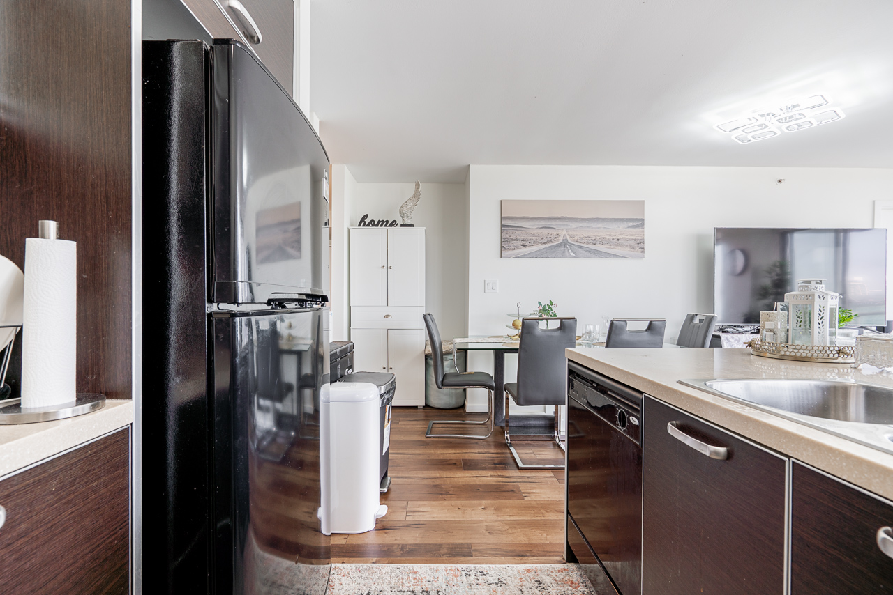 Open kitchen with quartz countertops and breakfast bar