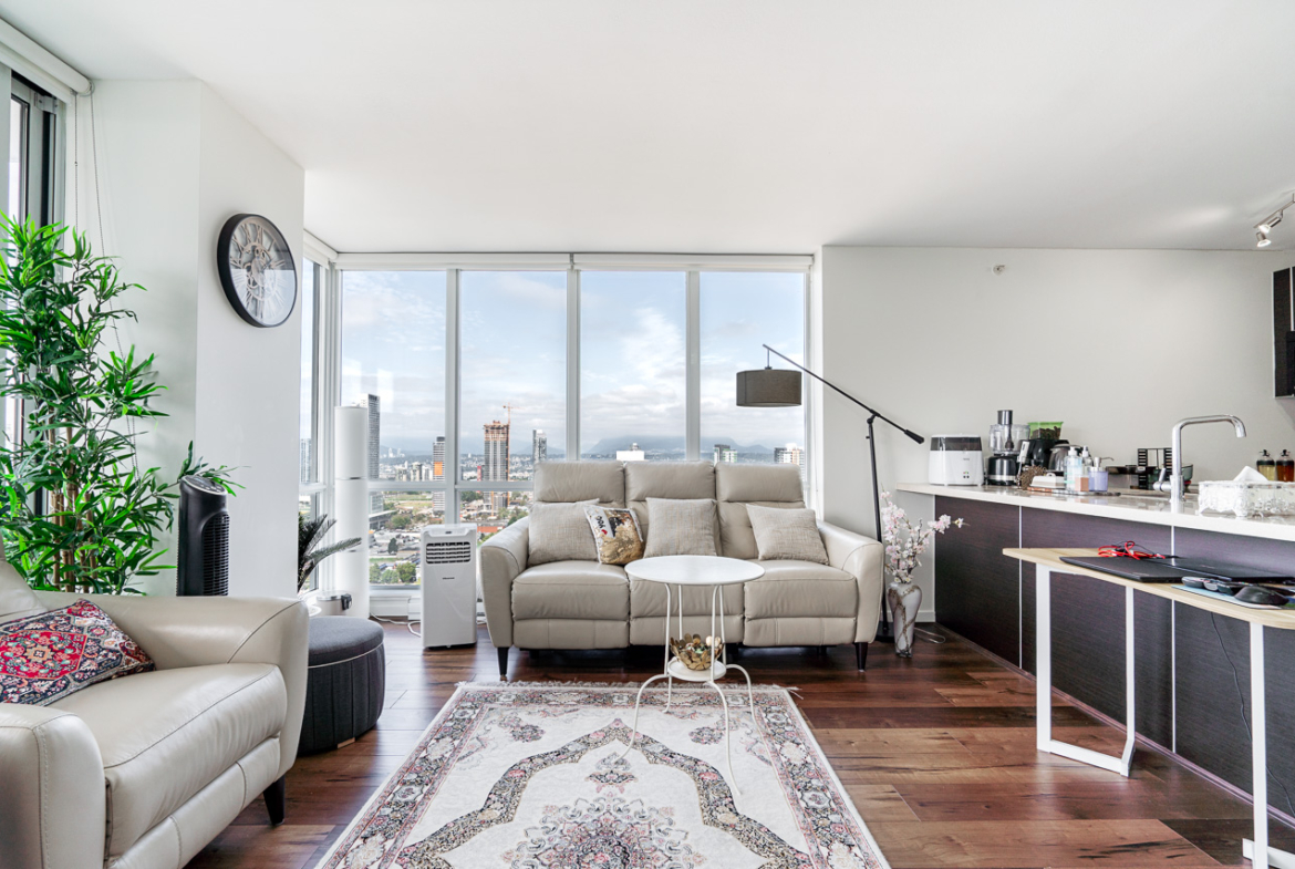 Open-concept living and dining area with modern flooring