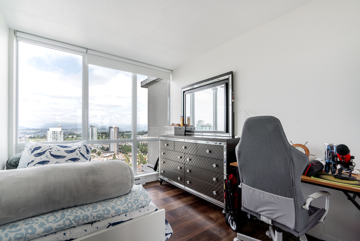 Living area with natural light and high-rise perspective