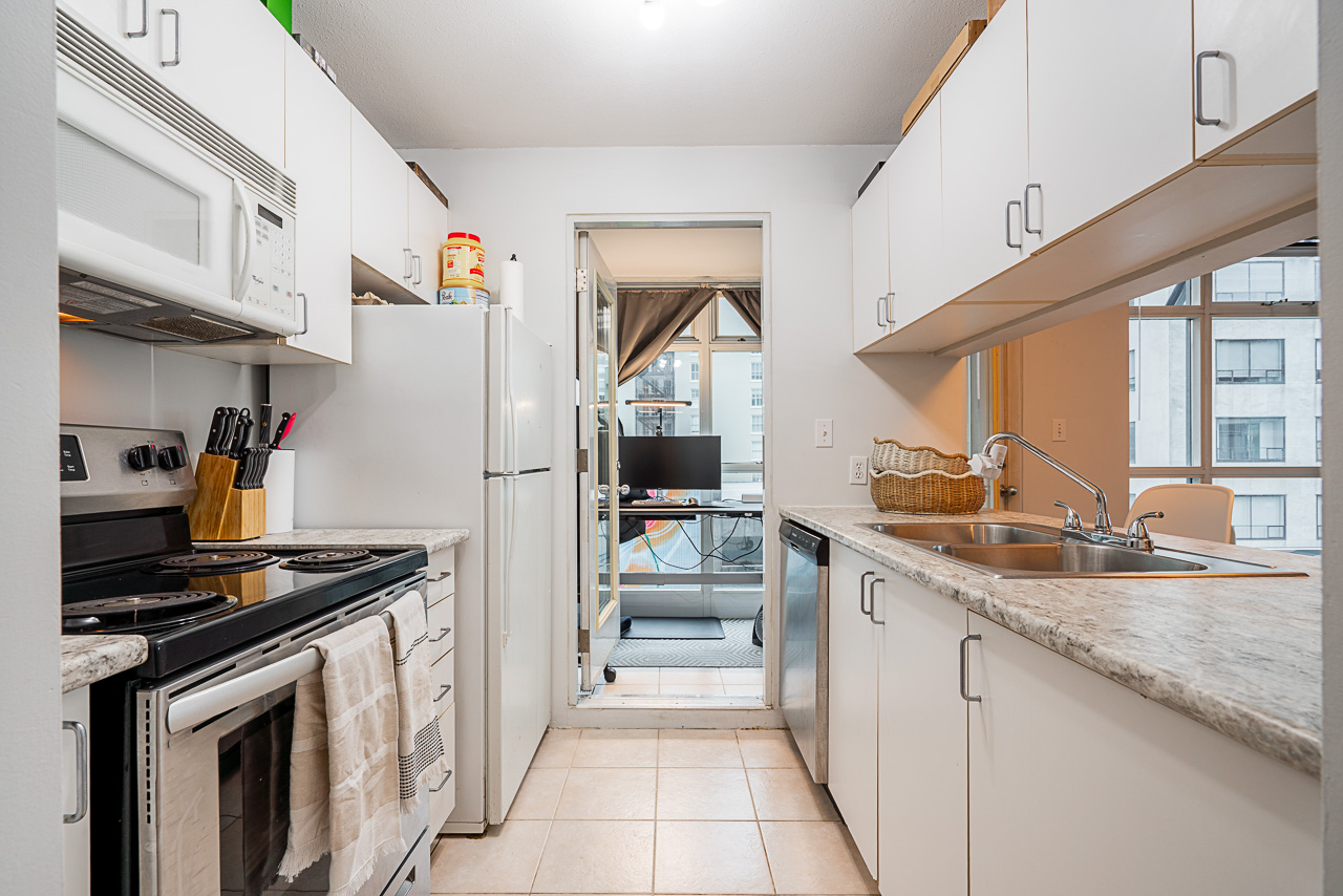 Unit 504 438 Seymour Street Vancouver-7 Open-concept kitchen with stainless appliances at 504–438 Seymour Street