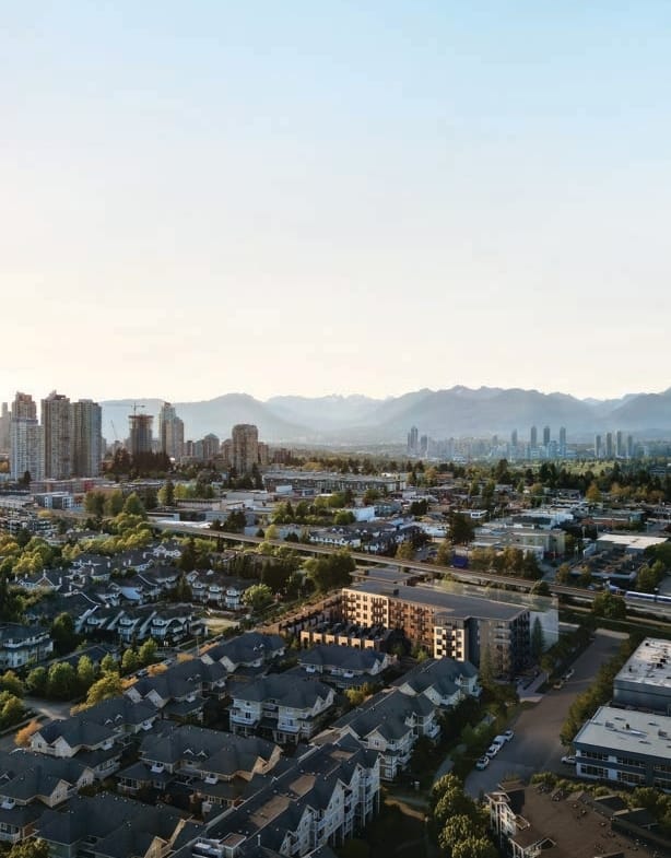 Aerial view of Koen by Beedie in South Burnaby with Metrotown skyline and mountain views