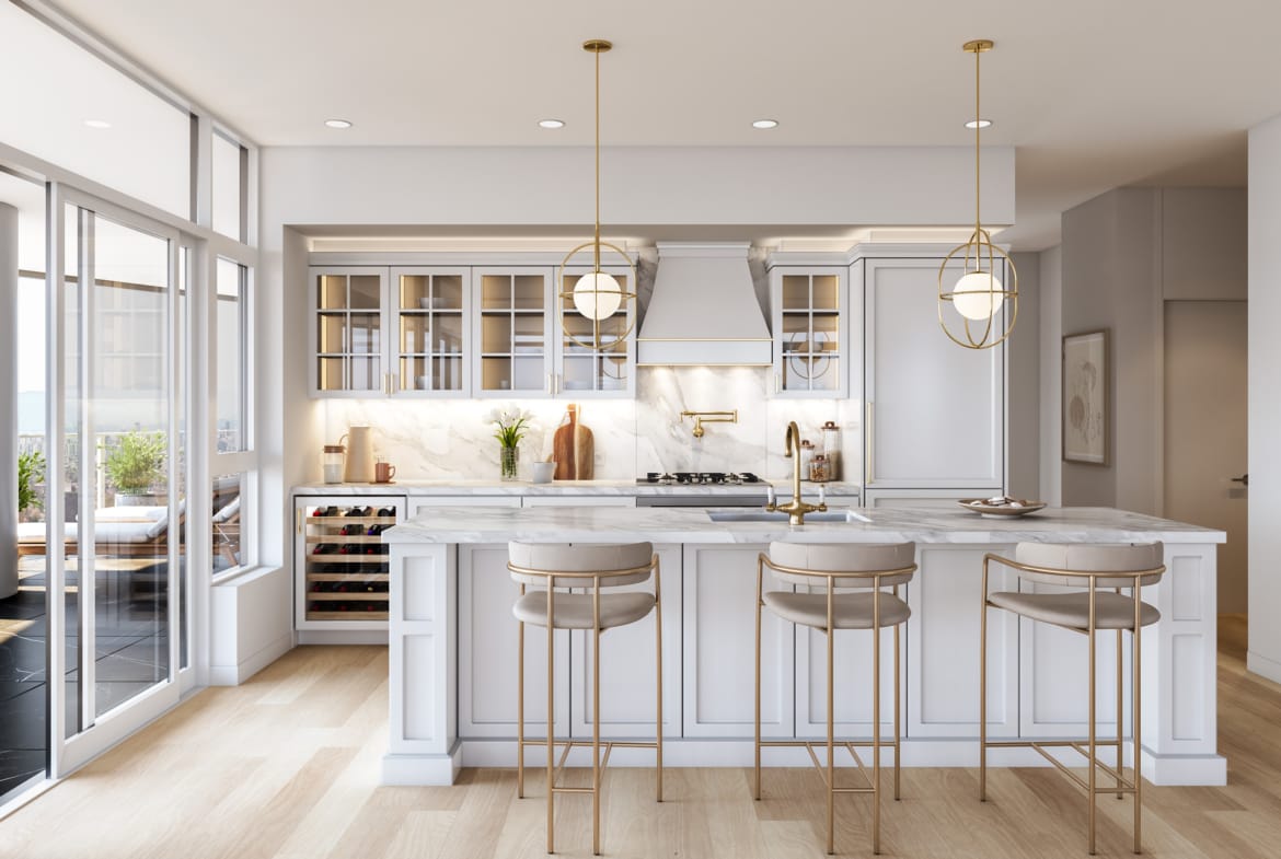 Luxury white kitchen with gold fixtures and quartz countertops at Greenhouse residences
