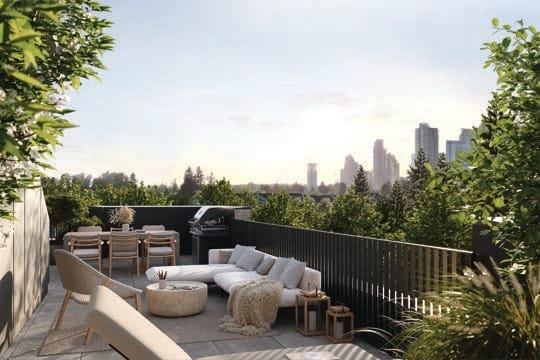 Private rooftop deck at Koen townhome with outdoor seating and city views