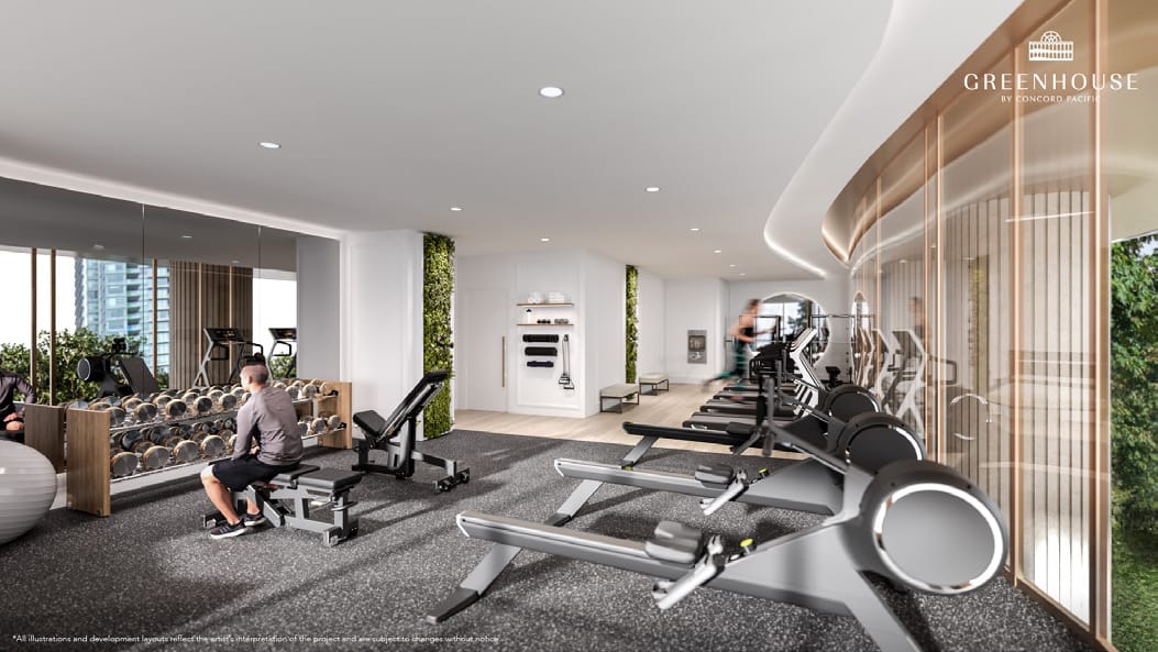 Modern fitness centre with cardio machines and weights at Greenhouse Burnaby