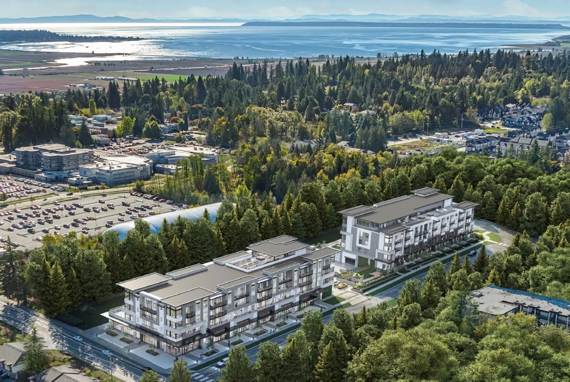 Aerial view of Amson Bloc surrounded by greenery and ocean proximity