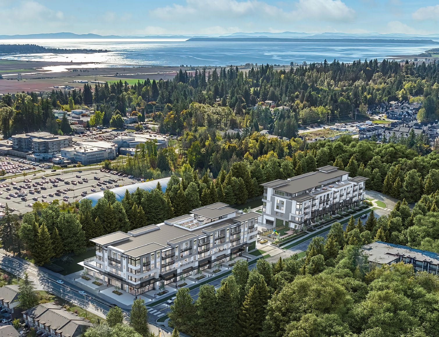 Aerial view of Amson Bloc surrounded by greenery and ocean proximity