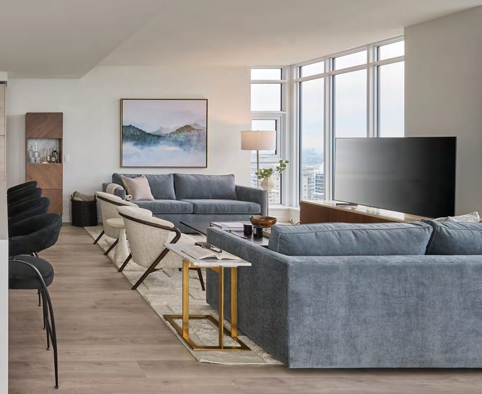 Bright living room floor-to-ceiling windows Pier West condo