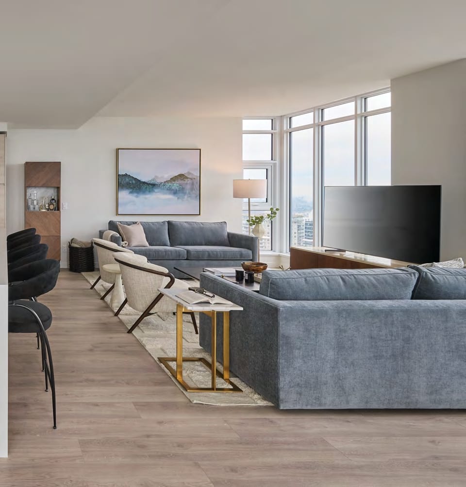 Bright living room floor-to-ceiling windows Pier West condo
