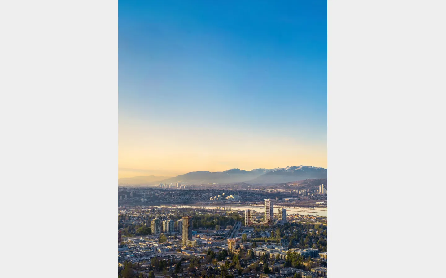 Aerial skyline view showing Bridge City towers near Fraser River