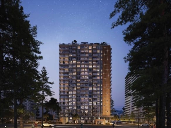 Modern high-rise tower Kwasen Village exterior night view