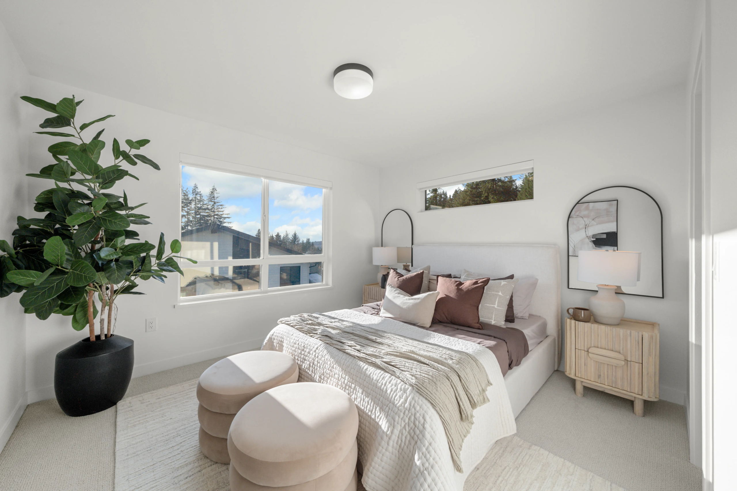 Spacious primary bedroom with mountain views
