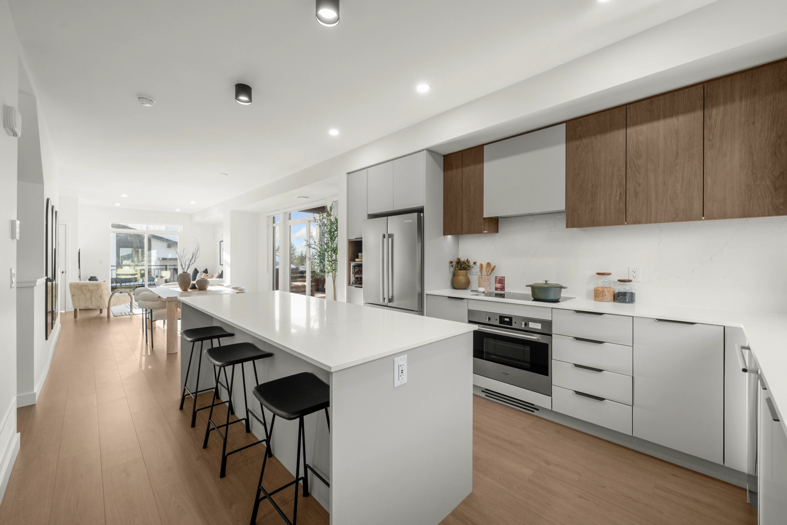 Modern white kitchen with large island at Heartwood