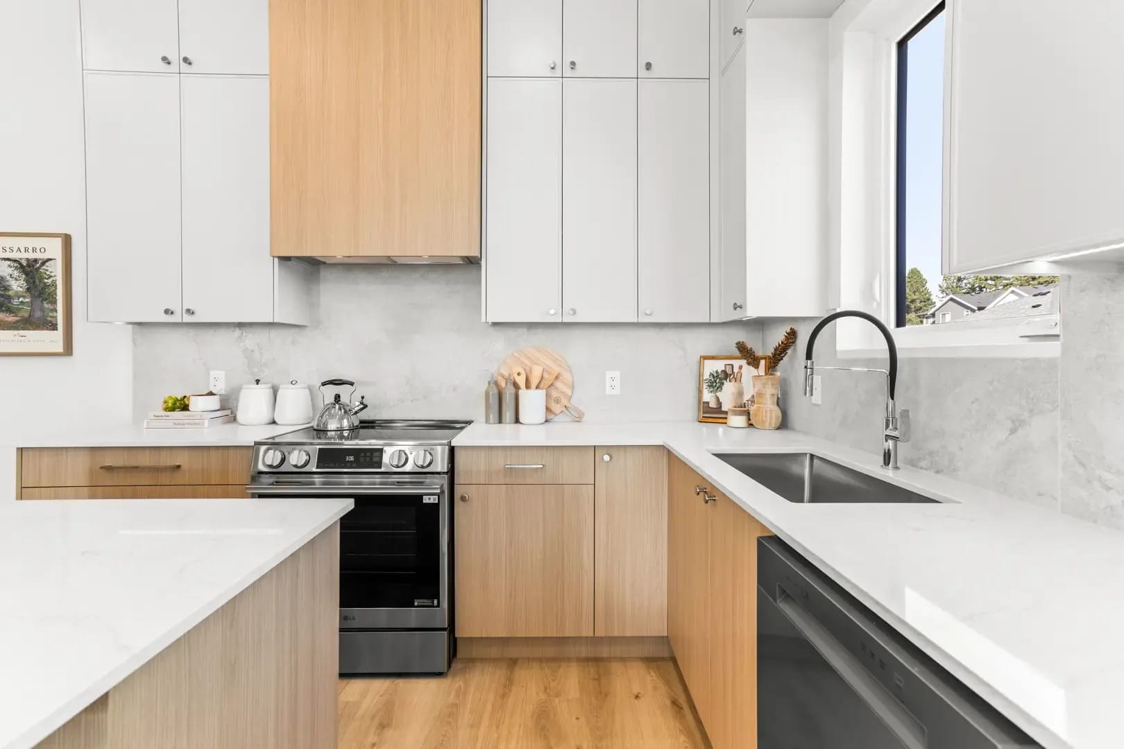 Bright open-concept kitchen and dining area with premium finishes