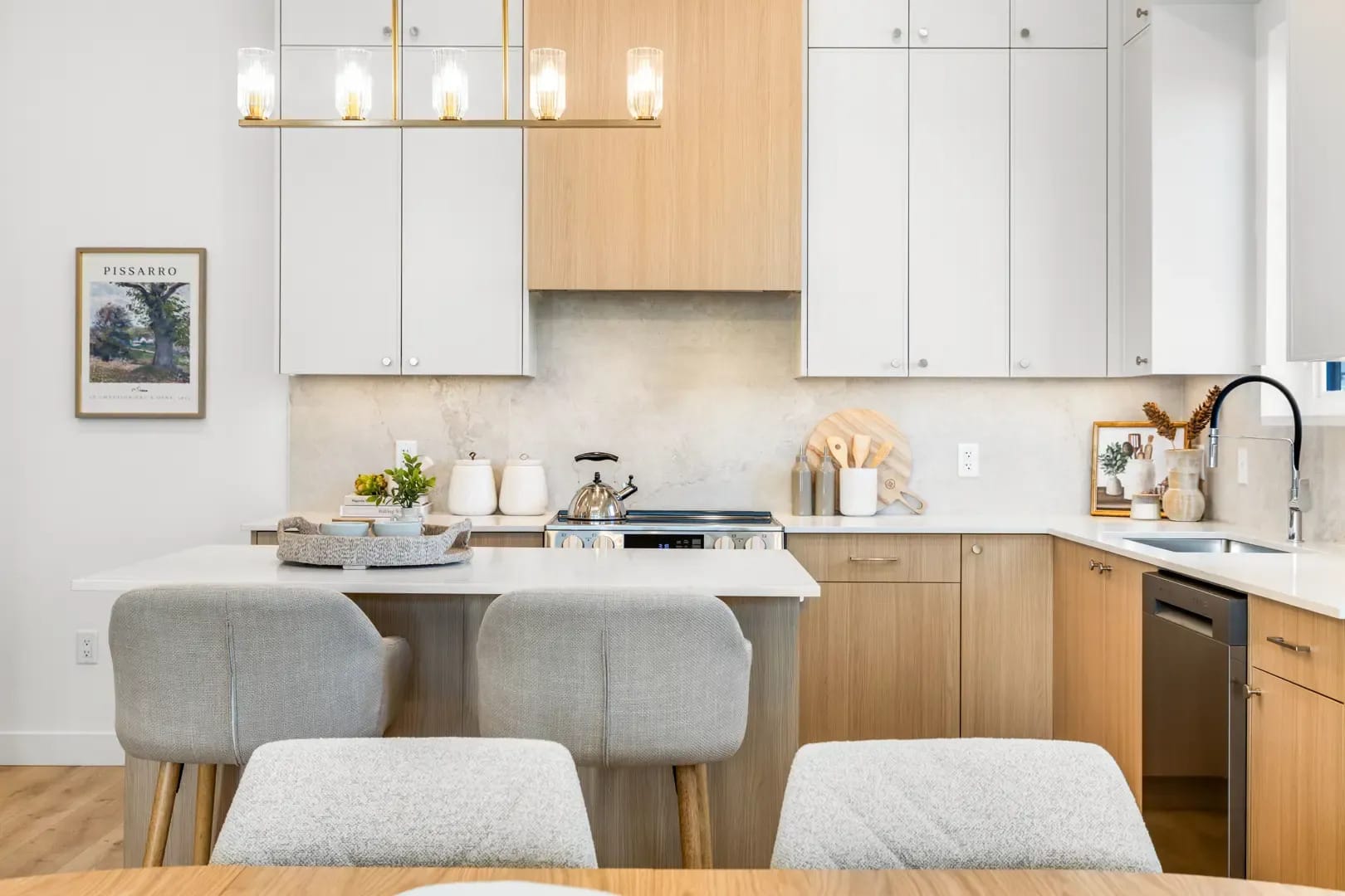 Modern kitchen with quartz countertops and two-tone cabinetry at Edgewood